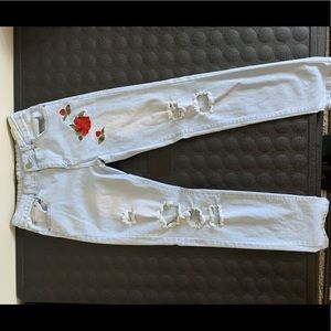 Mens blue jeans with roses